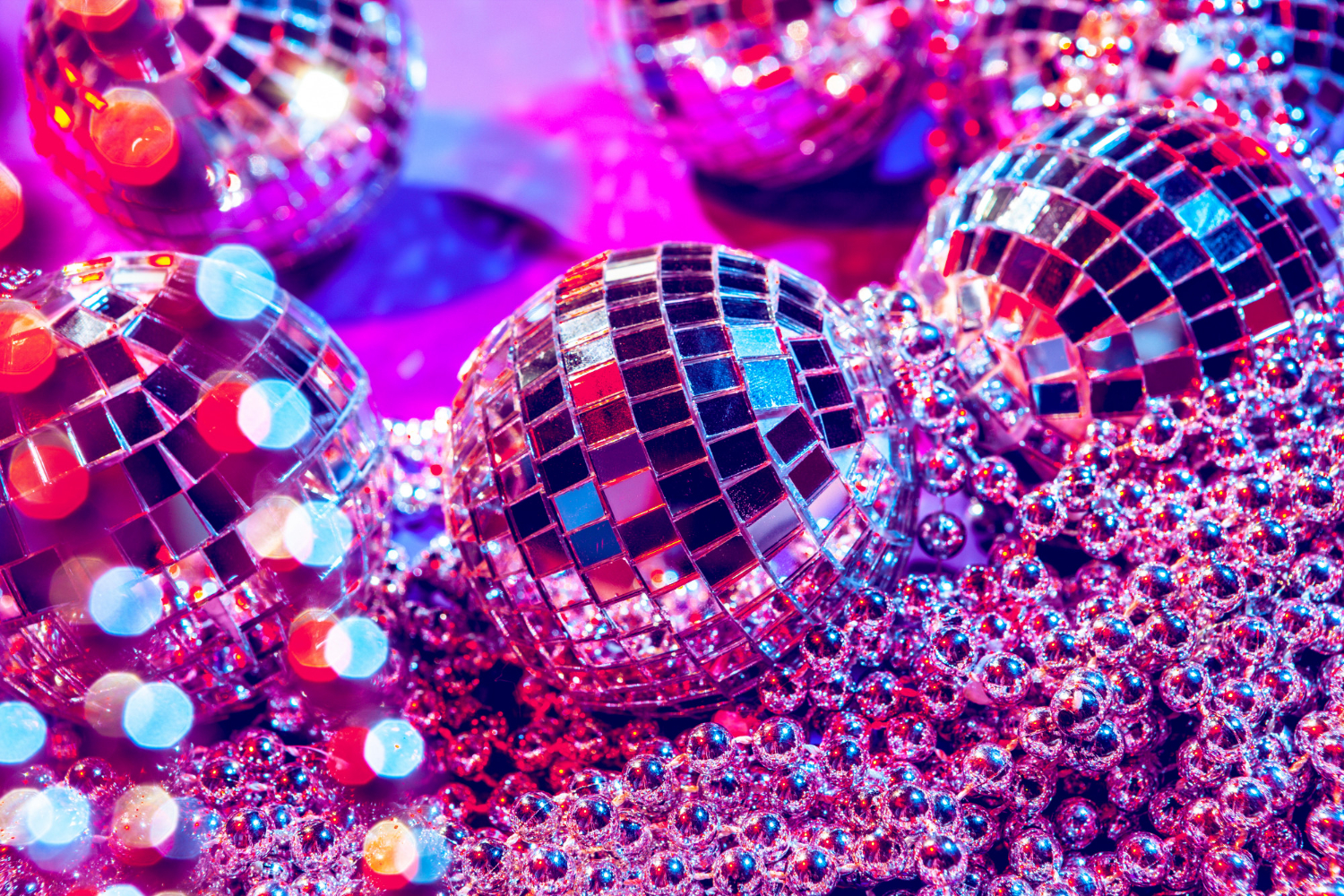 disco glitter balls and pearls in a pink light