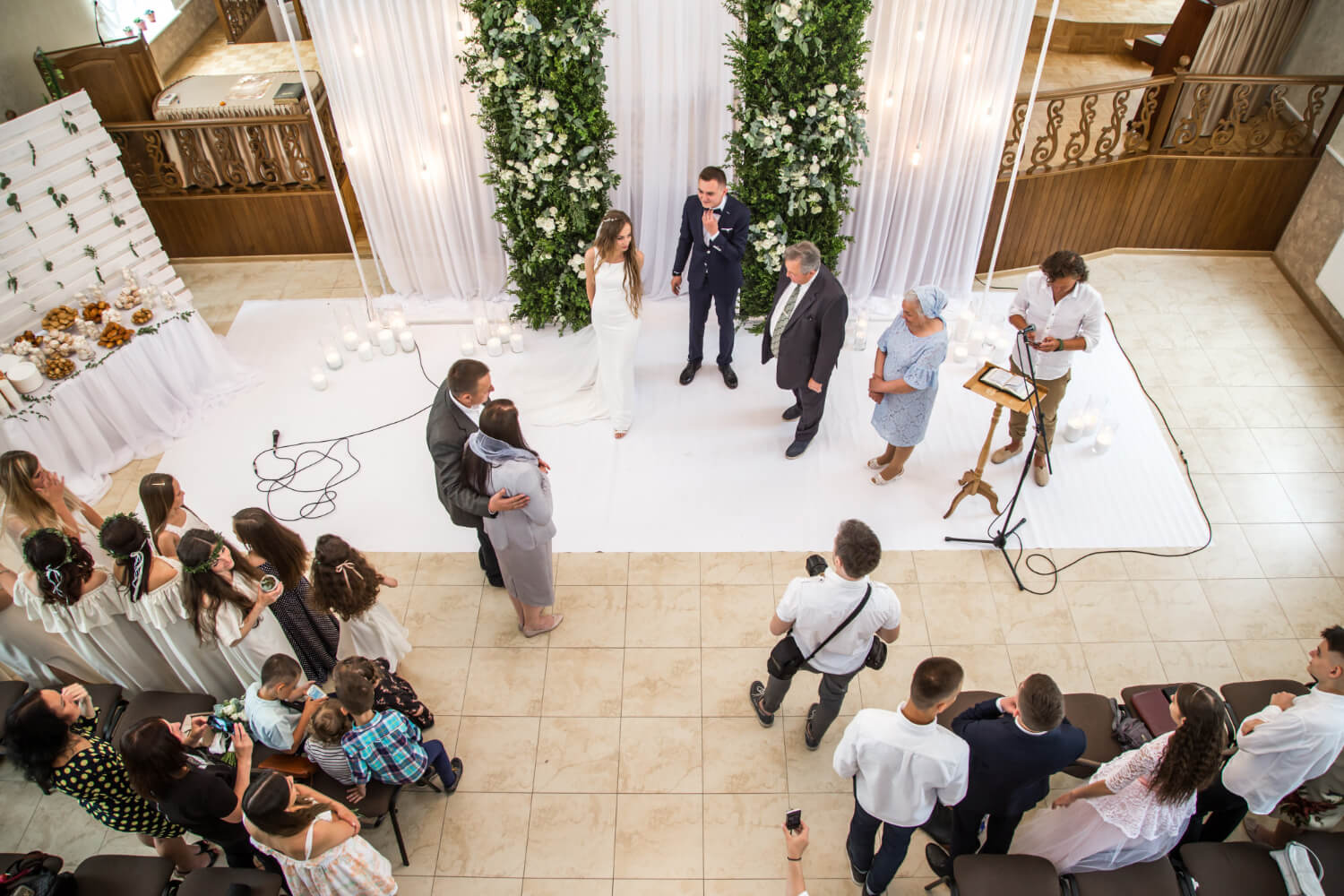 a wedding ceremony photographed from a top view