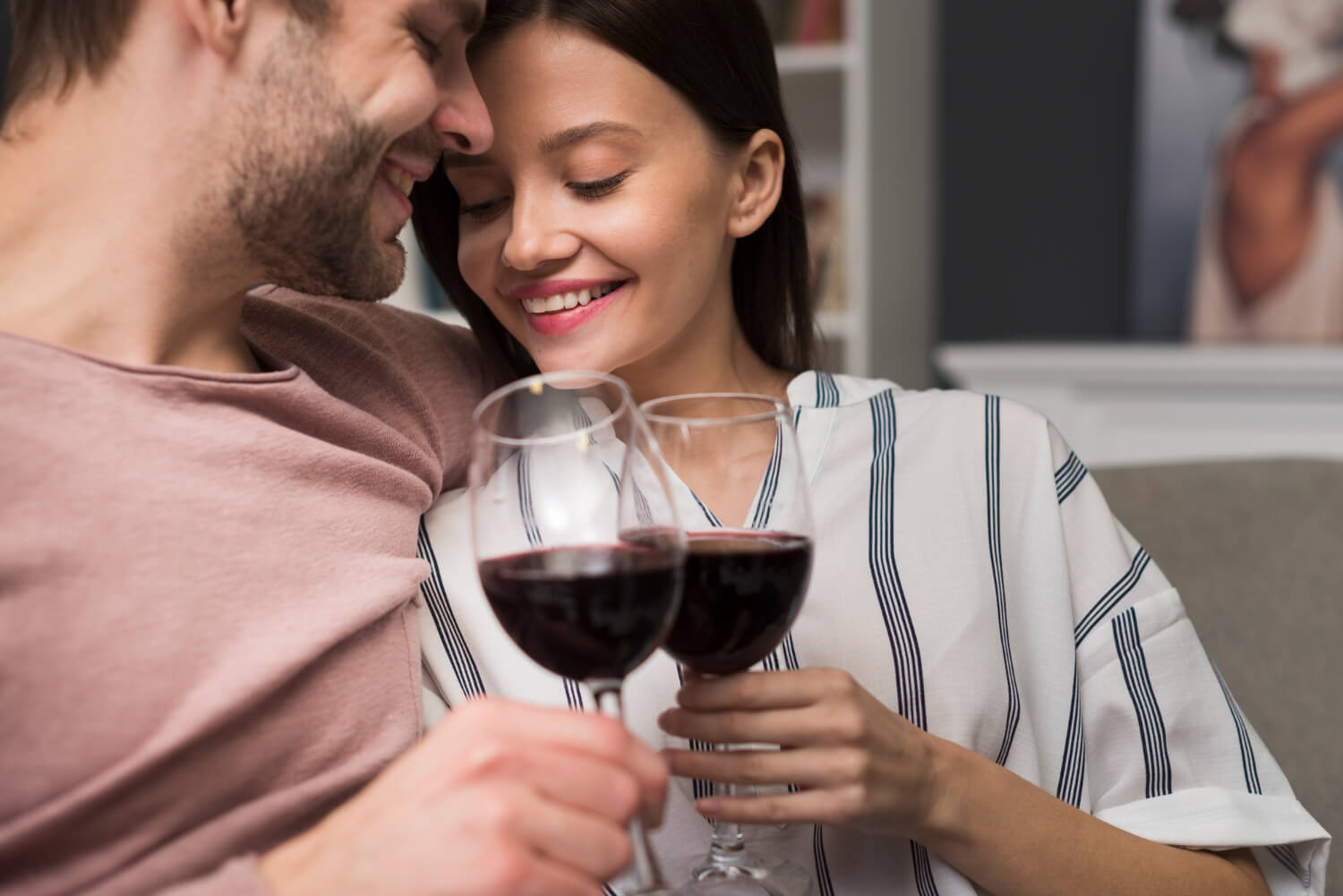 a couple drinking a glass of wine together