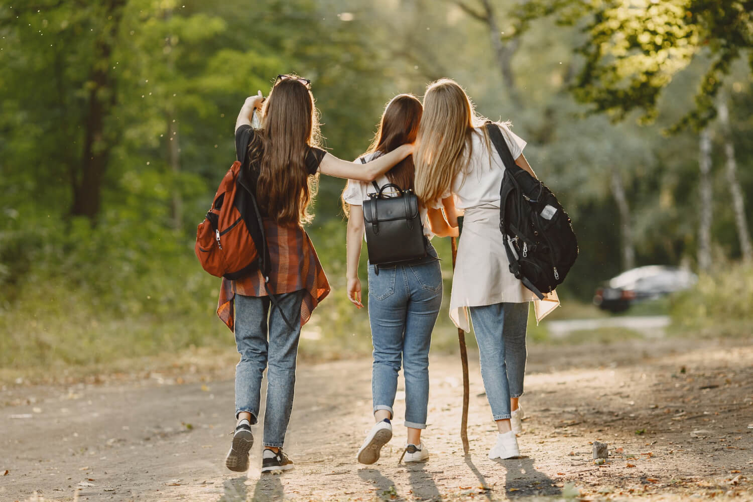 three women a hiking relaxed in the forest