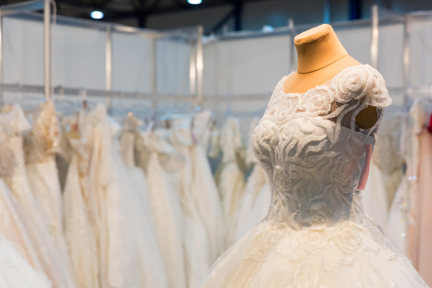 a wedding dress on a mannequin in a bridal store