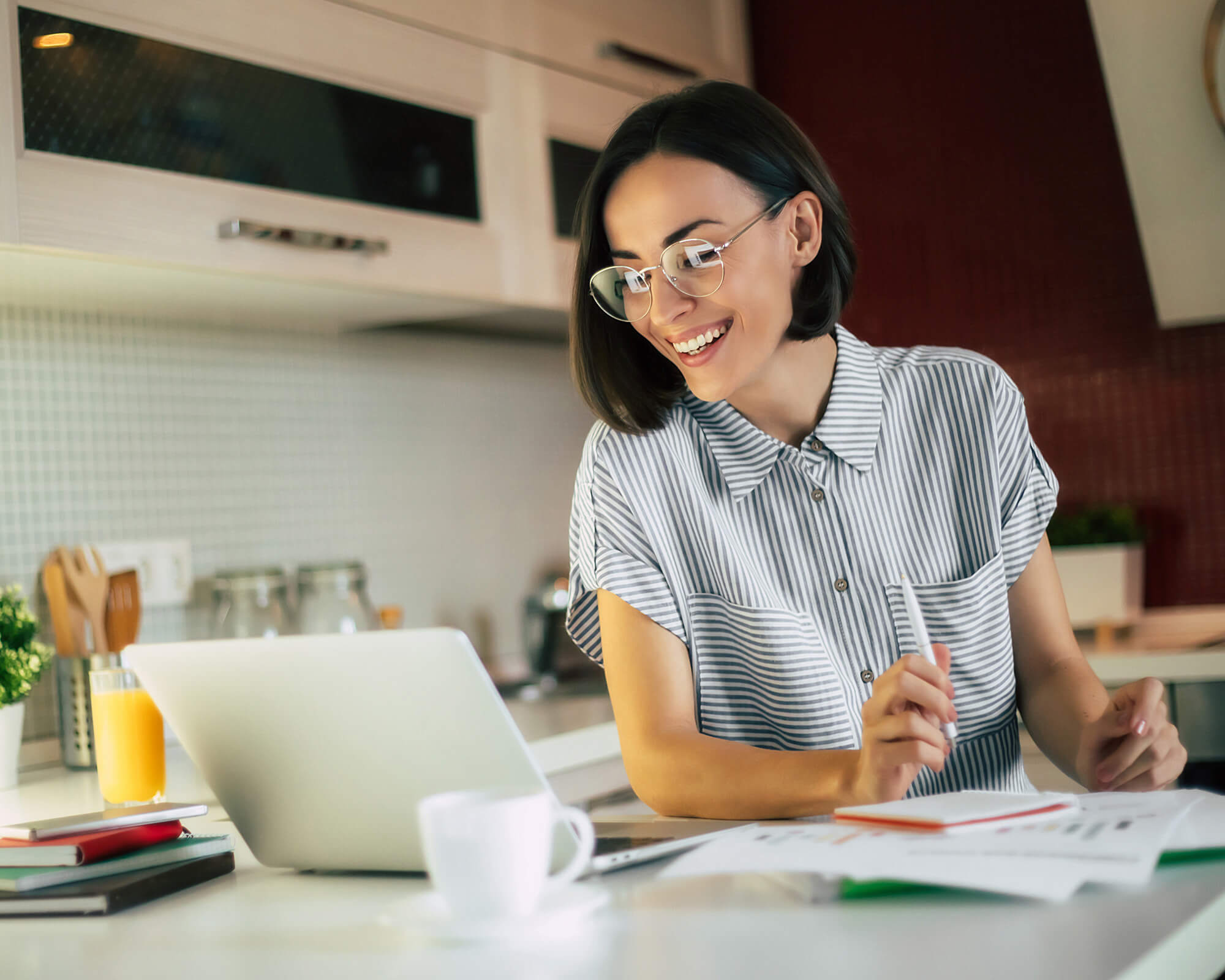 woman working with laptop in the kitchen